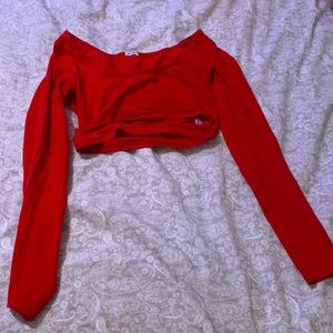A red cropped long sleeve shirt.